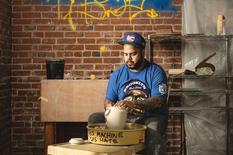 Roberto Lugo in his studio making pottery.