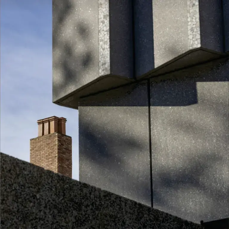 Cover of the Annual Report 2023-2024 showing the new museum exterior juxtaposed with brick chimney of a nearby campus building.